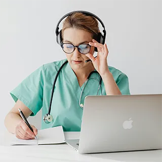 Provider with tablet reviewing patient information